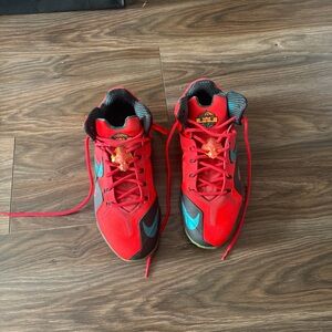 Nike Red and Black Athletic Shoes with Blue Highlights